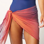 Ikonō La Nageuse one-piece swimsuit in blue, complemented with a vibrant scarf cover-up, offering a stylish and inclusive swimwear choice. Designed for comfort, support, and versatility, ideal for all body types, including post-mastectomy. Perfect for women looking for confidence and elegance by the water. #BeWhatMovesYou