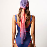 Ikonō La Nageuse one-piece swimsuit in blue, complemented with a vibrant scarf cover-up, offering a stylish and inclusive swimwear choice. Designed for comfort, support, and versatility, ideal for all body types, including post-mastectomy. Perfect for women looking for confidence and elegance by the water. #BeWhatMovesYou