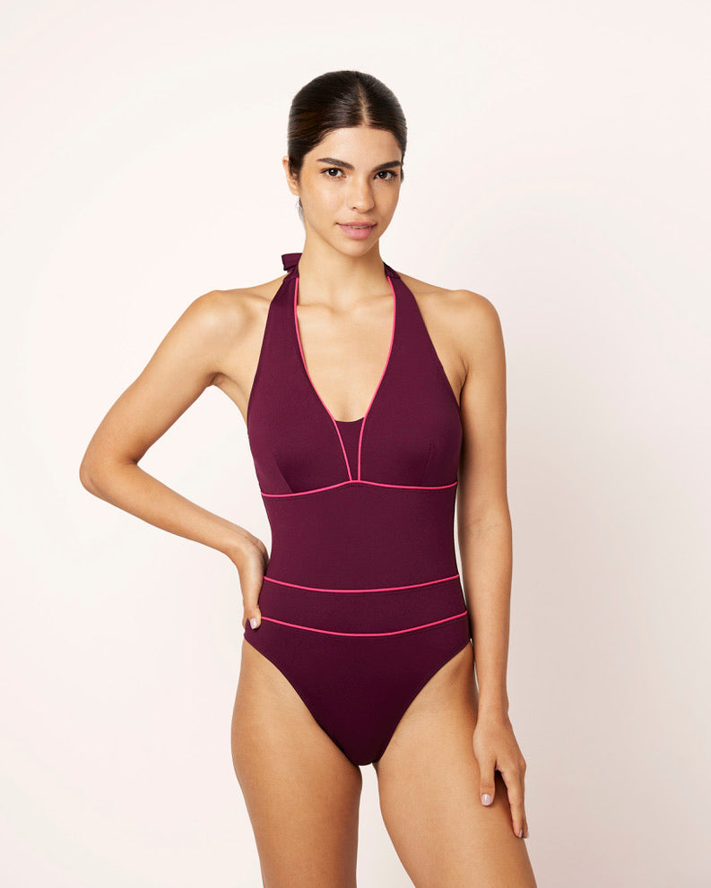 Ikonō La Versatile one-piece swimwear in aubergine. This high-quality, eco-friendly swimsuit is designed for comfort and support, featuring a soft lining and sculpting effect. Perfect for all body types, including post-surgery and mastectomy needs. A stylish, inclusive swimwear option. #BeWhatMovesYou