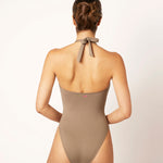 Ikonō La Versatile one-piece swimwear in Tierra. This high-quality, eco-friendly swimsuit is designed for comfort and support, featuring a soft lining and sculpting effect. Perfect for all body types, including post-surgery and mastectomy needs. A stylish, inclusive swimwear option. #BeWhatMovesYou