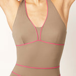 Ikonō La Versatile one-piece swimwear in Tierra. This high-quality, eco-friendly swimsuit is designed for comfort and support, featuring a soft lining and sculpting effect. Perfect for all body types, including post-surgery and mastectomy needs. A stylish, inclusive swimwear option. #BeWhatMovesYou