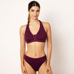 Ikonō La Versatile bikini in aubergine with a classic bottom. Designed for comfort and support, this stylish and inclusive swimwear features eco-friendly materials and a soft, supportive bra. Ideal for all body types, including post-surgery swimwear needs. A perfect combination of elegance and confidence. #BeWhatMovesYou
