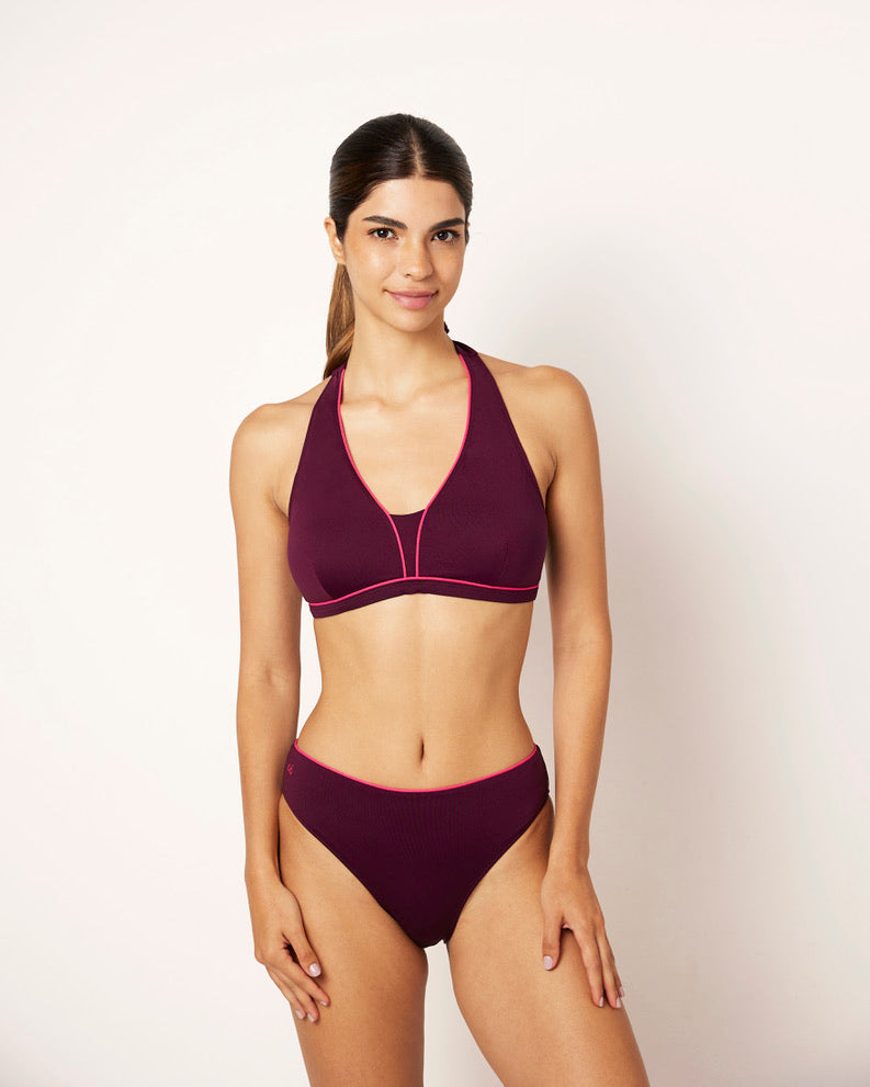 Ikonō La Versatile bikini in aubergine with a classic bottom. Designed for comfort and support, this stylish and inclusive swimwear features eco-friendly materials and a soft, supportive bra. Ideal for all body types, including post-surgery swimwear needs. A perfect combination of elegance and confidence. #BeWhatMovesYou