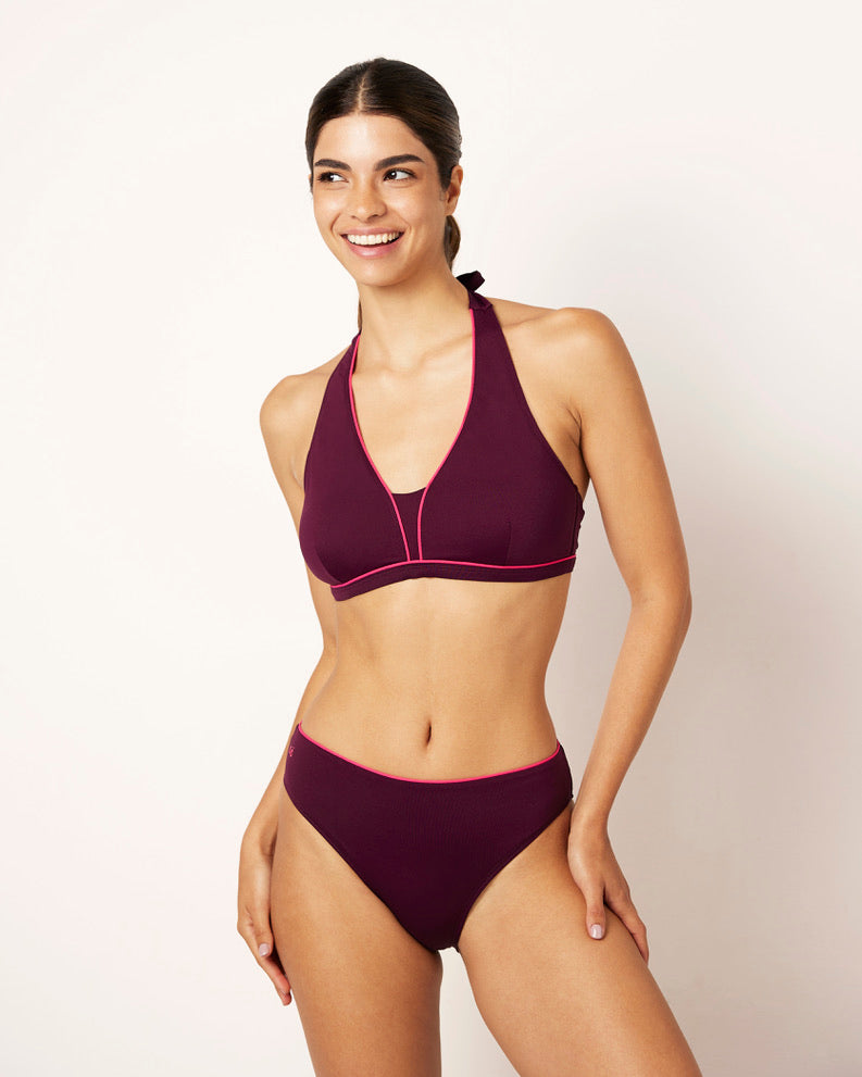 Ikonō La Versatile bikini in aubergine with a classic bottom. Designed for comfort and support, this stylish and inclusive swimwear features eco-friendly materials and a soft, supportive bra. Ideal for all body types, including post-surgery swimwear needs. A perfect combination of elegance and confidence. #BeWhatMovesYou