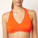 Ikonō La Versatile bikini swimsuit in Orange with supportive bra and secret pocket for optional prosthesis. Designed for comfort and support, made from eco-friendly materials. Perfect for all body types, including post-surgery swimwear needs. A stylish and inclusive swimwear choice. #BeWhatMovesYou
