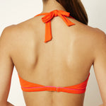 Ikonō La Versatile bikini swimsuit in Orange with supportive bra and secret pocket for optional prosthesis. Designed for comfort and support, made from eco-friendly materials. Perfect for all body types, including post-surgery swimwear needs. A stylish and inclusive swimwear choice. #BeWhatMovesYou